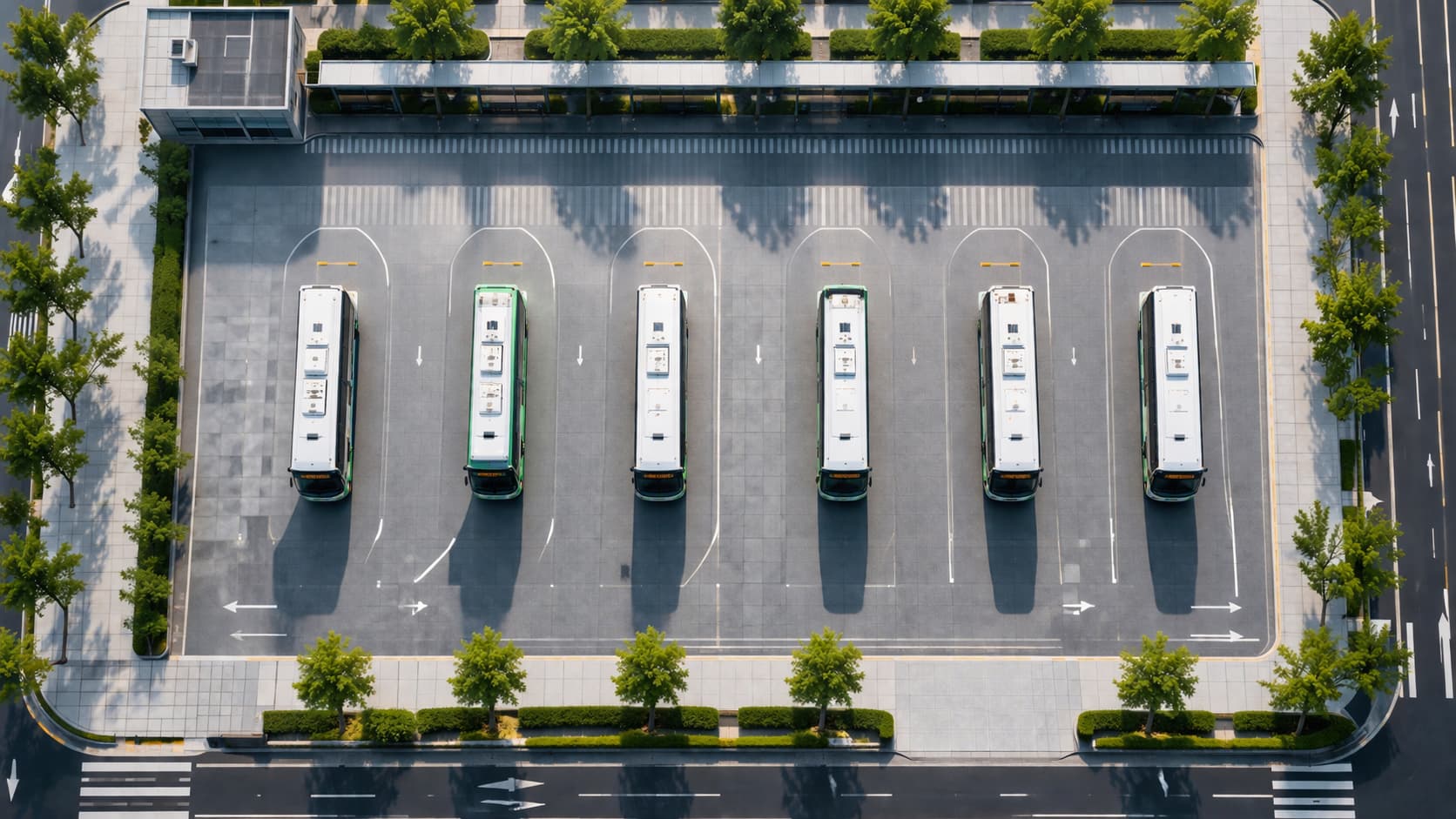Buses are stationed at the depot, awaiting dispatch
